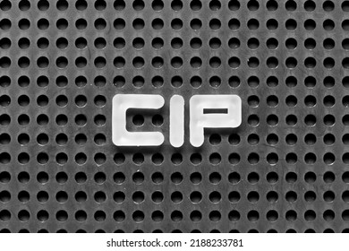 White Alphabet Letter In Word CIP (Abbreviation Of Carriage And Insurance Paid To, Continual Improvement Process Or Clean-in-place) On Black Pegboard Background