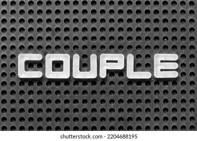 White Alphabet Letter In Word Couple On Black Pegboard Background