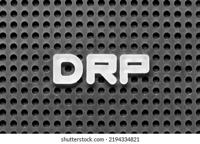 White Alphabet Letter In Word DRP (Abbreviation Of Disaster Recovery Plan, Distribution Resource Planning, Dividend Reinvestment Plan, Direct Repair Program Or Digital Remaster Processing) On Pegboard