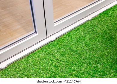 White Aluminium Door And Grass Floor Decoration 