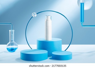 White anti cough spray utensils and props in front of blue scientific background - Shutterstock ID 2177003135