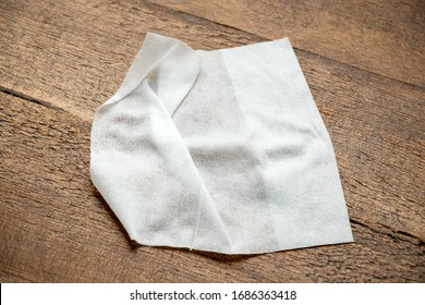 White Antibacterial Wet Wipe On Wooden Table