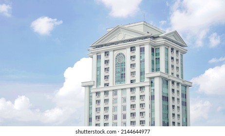 White Apartment Building With Clear Sky Background In Jakarta