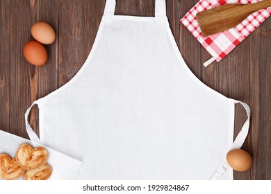 White Apron Template On Wooden Background, Copy Space. Kitchen, Cooking Clothing Mockup