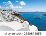 White architecture in Santorini island, Greece. Beautiful sea view in sunny day. Travel and vacation concept