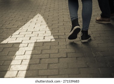 White arrow straight sign on street with walking people dark vintage tone - Shutterstock ID 271539683
