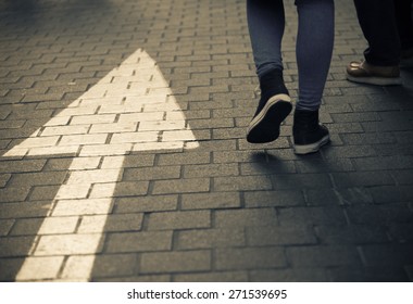 White arrow straight sign on street with walking people   - Shutterstock ID 271539695