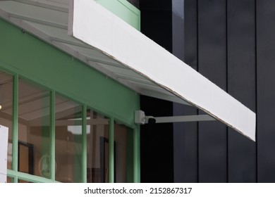 White Awning Over Shop Window. Tent Canvas Roof Background And Texture.