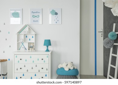 White Baby Bedroom With Dresser, Pouf And Wall Posters