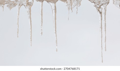 A white background with icicles hanging from the ceiling. The icicles are long and thin