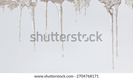 A white background with icicles hanging from the ceiling. The icicles are long and thin