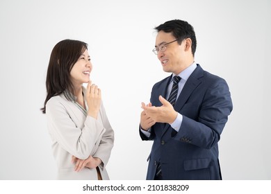 White background of male and female businessmen chatting