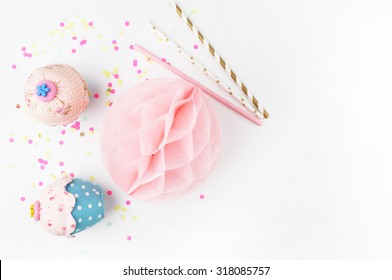 White Background With Party Accessories. Invitation Mockup. Confetti And Muffins. Cake