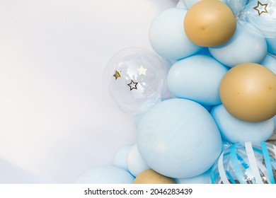 White background with a place for text decorated with blue and yellow balloons.
