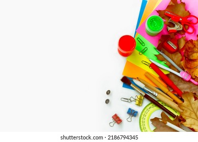 White background with school stationery, back to school concept, autumn theme