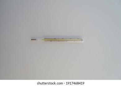 The white background and thermometer