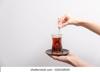 İsolated  White Background Turkish Tea, Turkish Tea Hold By Hand. 