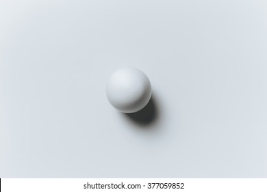 White ball on the white background in center. Design, visual art, minimalism