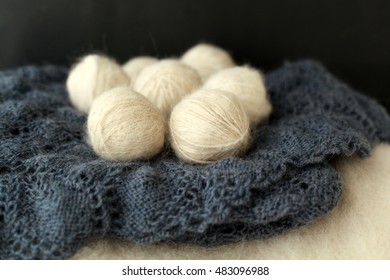 White Balls Of Wool Lying On The Shawl