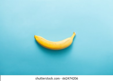 White Banana Shape On Pastel Blue Background. Minimal Fashion, Flatlay. Albino Different Creativity Creative Thinking Ideas Concept. Free Space Foe Text