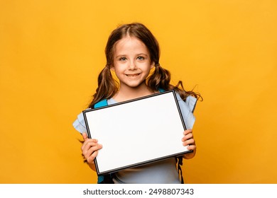 White banner. Little child girl model in summer blue and white cloth on white background hold white blank paper. Young smiling girl show blank board. - Powered by Shutterstock