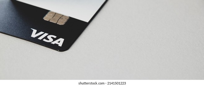 White banner with VISA bank payment card close-up and free space for text. Riga, Latvia - 26 Mar 2022. - Shutterstock ID 2141501223