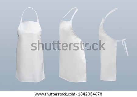 White Basic Bib kitchen Apron accessory, clothing and PVC Full white Apron for women protection ware isolated on gray background. This has clipping path. 