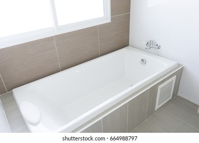 White bath tub at home - Shutterstock ID 664988797