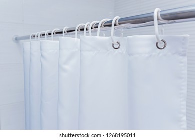 White Bathroom With Black And White Shower Curtain.