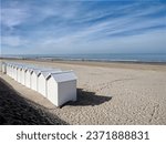 White beach cabins on the beach of Fort Mahon, a commune in the Somme department in Hauts-de-France in northern France. 