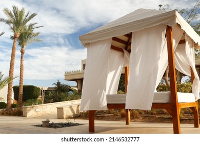 White beach canopies. Luxury beach tents at a resort near palms. gazebo, Outdoors