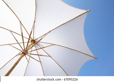 White Beach Umbrella With Blue Sky