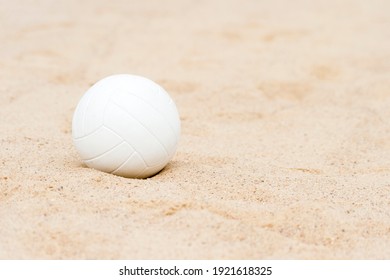 White beach volleyball in the sand. Team sport concept