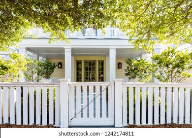 White Beach Wooden Wood Architecture Of House, Door Gate To Front Porch Yard With Green Landscaping Trees, Vacation Cottage Home, Fence