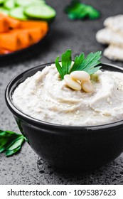 White Bean Dip On Dark Concrete Background. Selective Focus, Space For Text. 