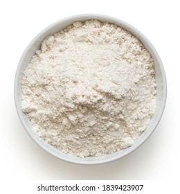 White bean gluten free flour in a white ceramic bowl isolated on white. Top view.