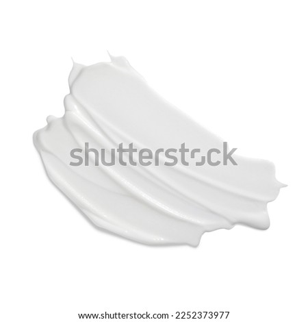 White beauty cream smear smudge on white background. Cosmetic skincare product texture. Face cream, body lotion swipe swatch