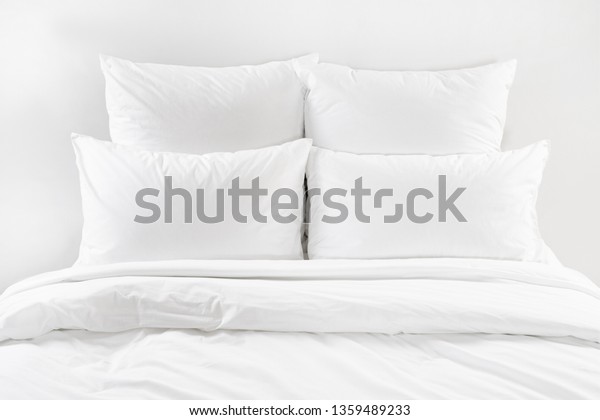 White bed isolated, white bed linen\
isolated, bed with pillows isolated, four white pillows and duvet\
on a bed, bedroom interior with a white\
bedding