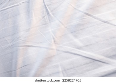 white bed linen gradient texture blurred curve style of abstract luxury fabric,Wrinkled bed linen and dark gray shadows,background - Shutterstock ID 2258224705