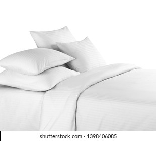 White bed linen on a white bed isolated. White bedroom with bedding. Bed with pillows and duvet isolated.