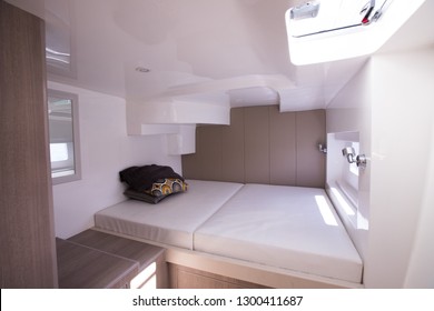 White Bedroom inside Yacht cruise with Windows sun ray, bed pillow blanket in guest room on ocean boat comfortable for all sailors and passenger during travel