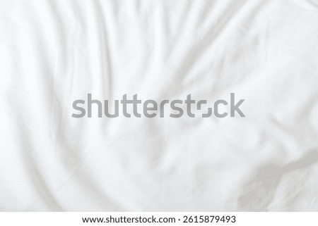 White bedsheet background, bed sheet texture, wrinkled duvet, crumpled satin blanket comforter cloth used in hotel, resort or home interior for bedding sleep comfort