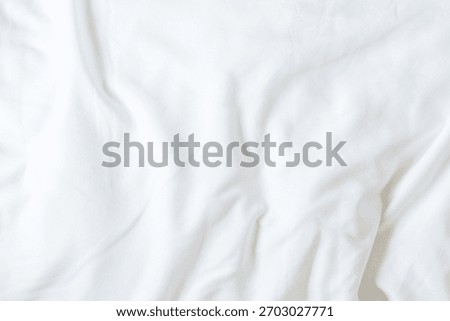 White bedsheet background, bed sheet cotton fabric texture, wrinkled duvet, crumpled satin blanket comforter cloth used in hotel, resort or home interior for bedding sleep comfort