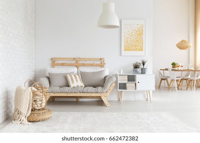 White, beige and gold furniture and decorations in living room