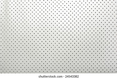 White, Beige Perforated Texture Leather Covering Seat In The Car Interior