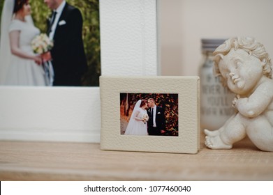 White and beige wedding book or album. - Shutterstock ID 1077460040
