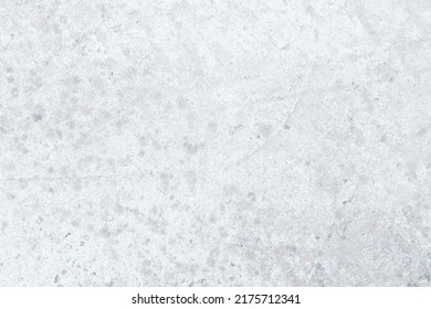 White beton texture, light gray concrete background, cement wall surface. Stucco, plaster. Blank space. Backdrop design. Natural grunge wallpaper, weathered old paper. Table with stains of paint.
