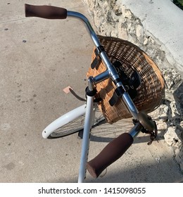 White Bicycle Handle Bars And Wicker Basket