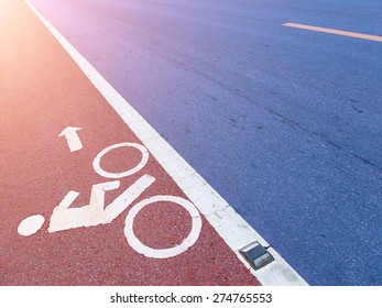  white bicycle path sign on the asphalt road - Shutterstock ID 274765553