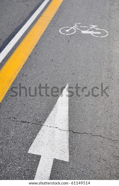 White bicycle sign\
painted on a street